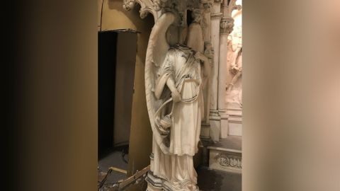 A head was removed from an angel statue flanking the alter during the theft, officials said.