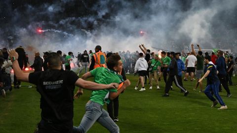 St Etienne: Chaos erupts as angry storm the pitch following club's to Ligue 2 | CNN