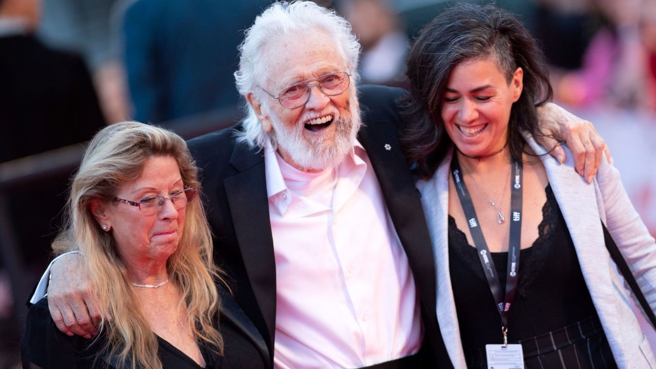 Wanda Hawkins, musician Ronnie Hawkins and guest arrive for the Opening Night Gala presentation of "Once Were Brothers: Robbie Robertson and The Band" during the Toronto International Film Festival, on September 5, 2019, in Toronto, Ontario, Canada.
