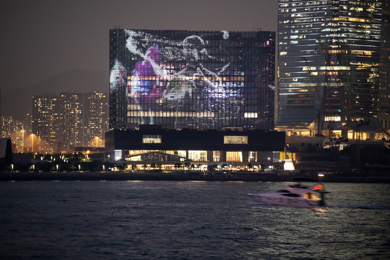"The Shape of Light" (2022) by Ellen Pao, a moving image work co-commissioned by Art Basel and M+, presented on the museum's facade. 
