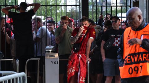 Liverpool fans are held at the gates - many feeling the effects of tear gas - ahead of the Champions League final.