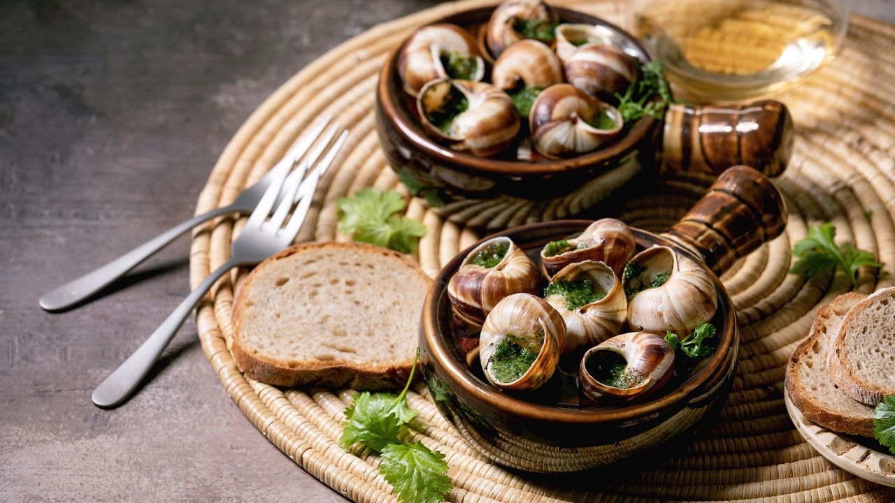 Escargots: Snails with parsley and garlic butter are a French delicacy.