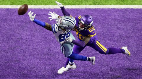 CeeDee Lamb of the Dallas Cowboys attempts to make a catch against Jeff Gladney of the Minnesota Vikings during an NFL game on November 22, 2020, in Minneapolis, Minnesota. 