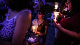 A young woman holds a candle during a candlelight vigil to honor and remember the victims of the mass shooting in Uvalde, Texas on May 30, 2022. - Grieving families were to hold the first funerals Tuesday for Texas shooting victims one week after a school massacre left 19 children and two teachers dead, with President Joe Biden vowing to push for stricter US gun regulation.
Mourners attended wakes in the town of Uvalde on Monday for some of the child victims gunned down by a local 18-year-old man who was then killed by police. (Photo by CHANDAN KHANNA / AFP) (Photo by CHANDAN KHANNA/AFP via Getty Images)