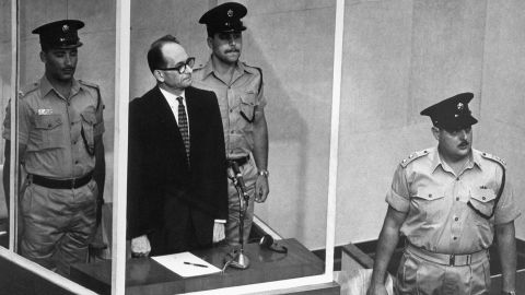 Adolf Eichmann stands in his bullet-proof glass cage to hear Israel's Supreme Court unanimously reject an appeal against his death sentence in Jerusalem on May 29, 1962.  