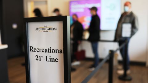 The first five customers wait in line to enter Apothecarium Dispensary on April 21, 2022, in Maplewood, New Jersey, on the first day of legal recreational marijuana sales in the state.