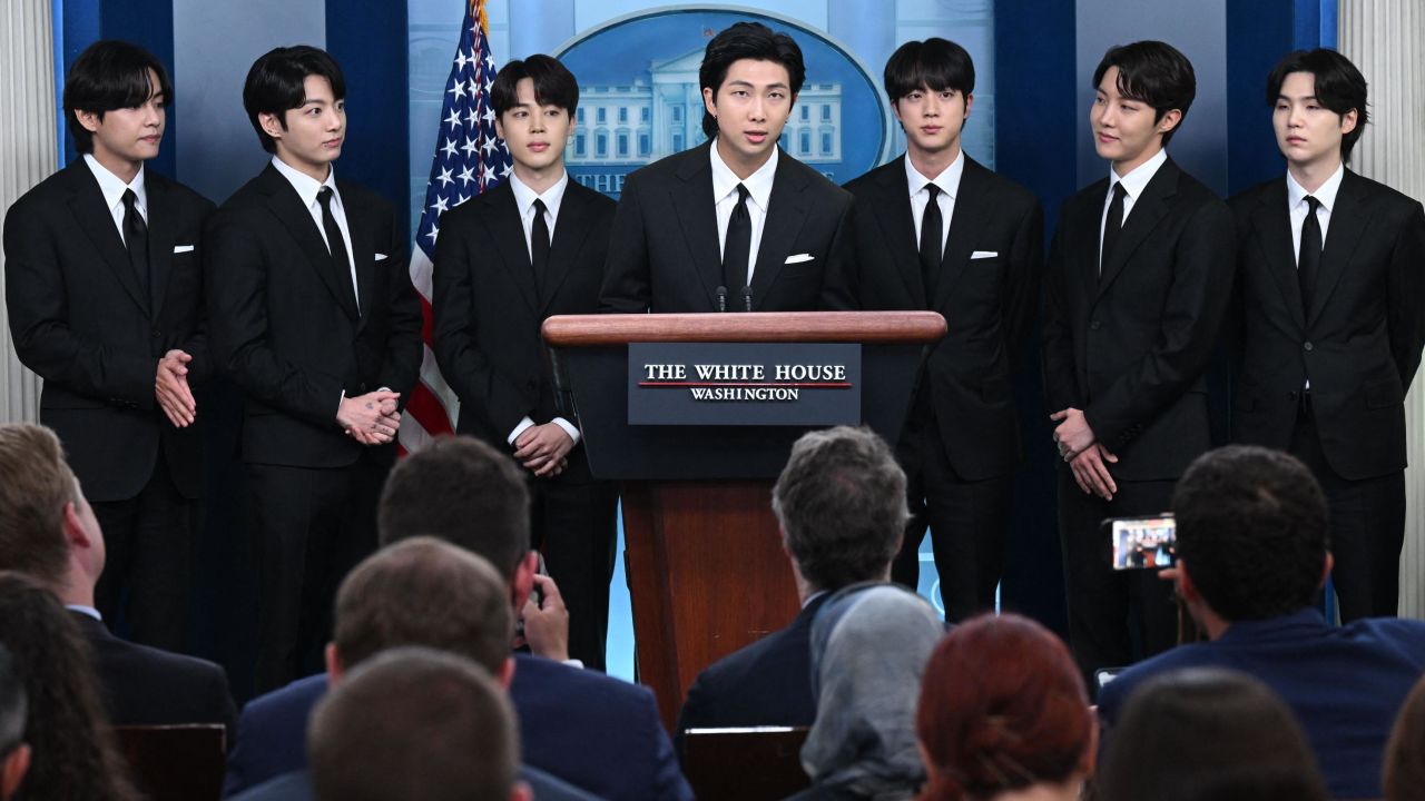 Korean band BTS appears at the daily press briefing in the Brady Press Briefing of the White House in Washington, DC, May 31, 2022, as they visit to discuss Asian inclusion and representation, and addressing anti-Asian hate crimes and discrimination. (Photo by SAUL LOEB / AFP) (Photo by SAUL LOEB/AFP via Getty Images)