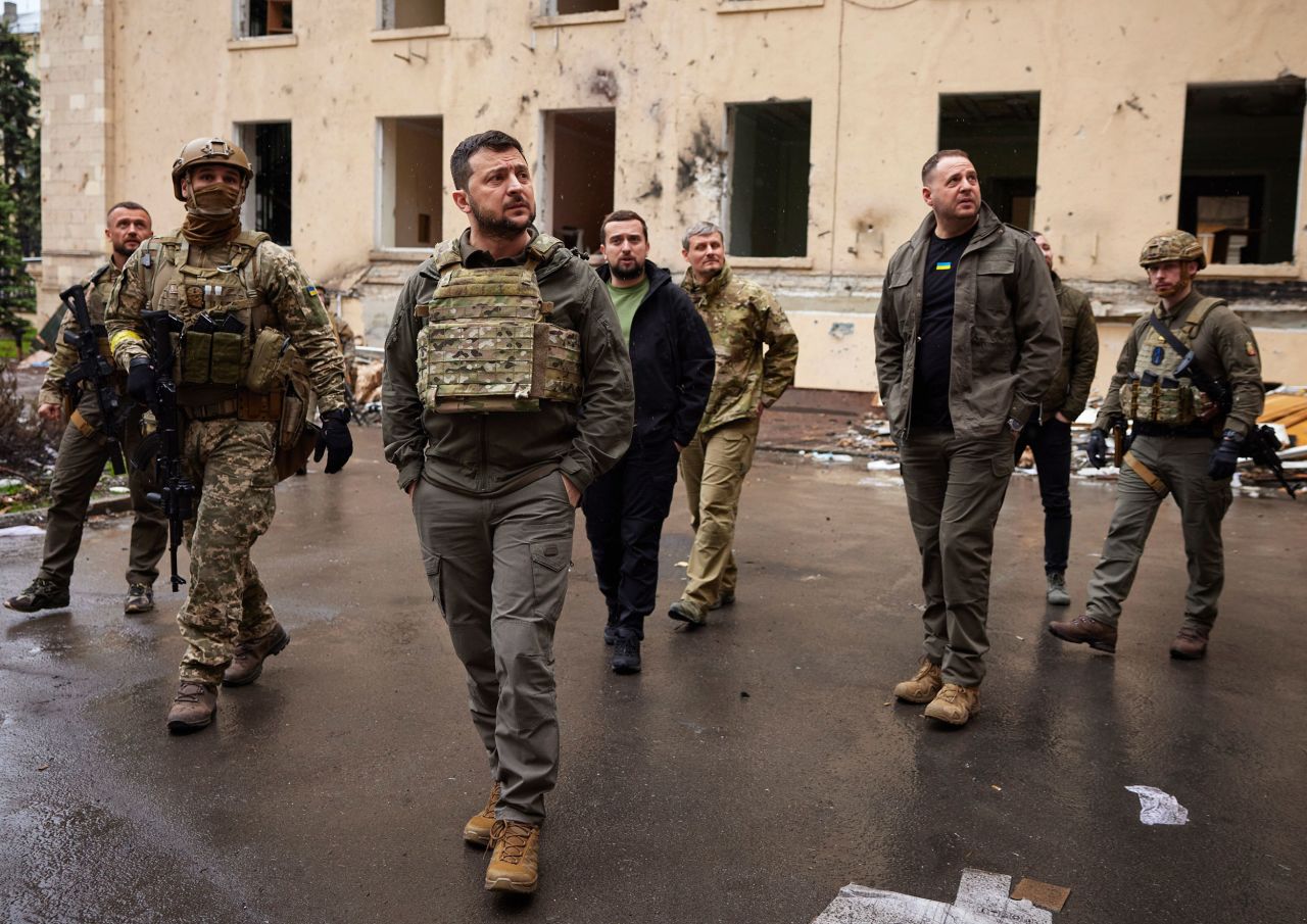 Ukrainian President Volodymyr Zelensky, third from left, visits front-line positions during a trip to the Kharkiv region on Sunday, May 29.   Zelensky says Russia waging war so Putin can stay in power &#8216;until the end of his life&#8217; 220531174739 zelensky kharkiv file 052922