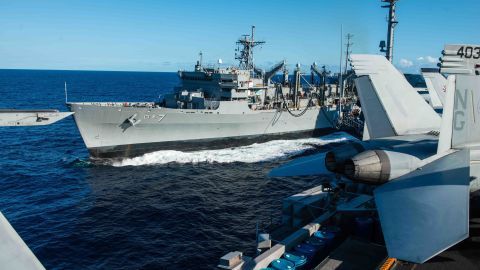 The fast combat support ship USNS Rainier steams alongside the aircraft carrier USS John C. Stennis during a replenishment-at-sea during the Rim of the Pacific maritime exercise in 2016.