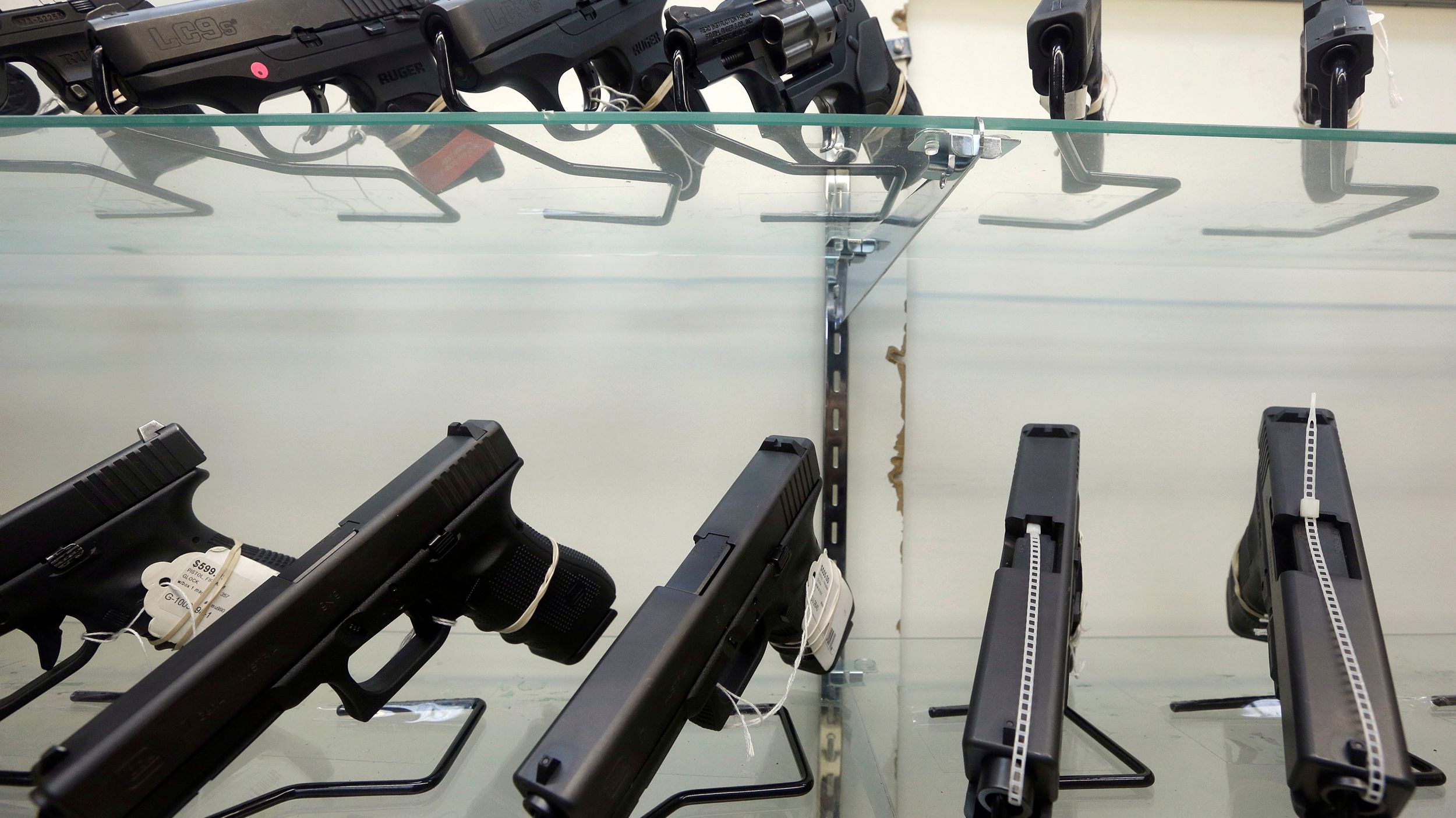 This June 29, 2016, file photo shows guns on display at a gun store in Miami. 