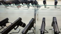 FILE - This June 29, 2016, file photo shows guns on display at a gun store in Miami. Support for tougher gun control laws is soaring in the United States, according to a new poll that found a majority of gun owners and half of Republicans favor new laws to address gun violence in the weeks after a Florida school shooting left 17 dead and sparked nationwide protests. (AP Photo/Alan Diaz, File)