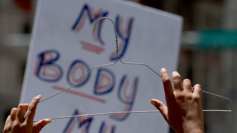 Abortion-rights supporters rally together on May 14 in Fort Lauderdale, Florida, in one of many demonstrations across the US in response to the leaked draft Supreme Court opinion that has suggested the Court is poised to overturn Roe v. Wade.