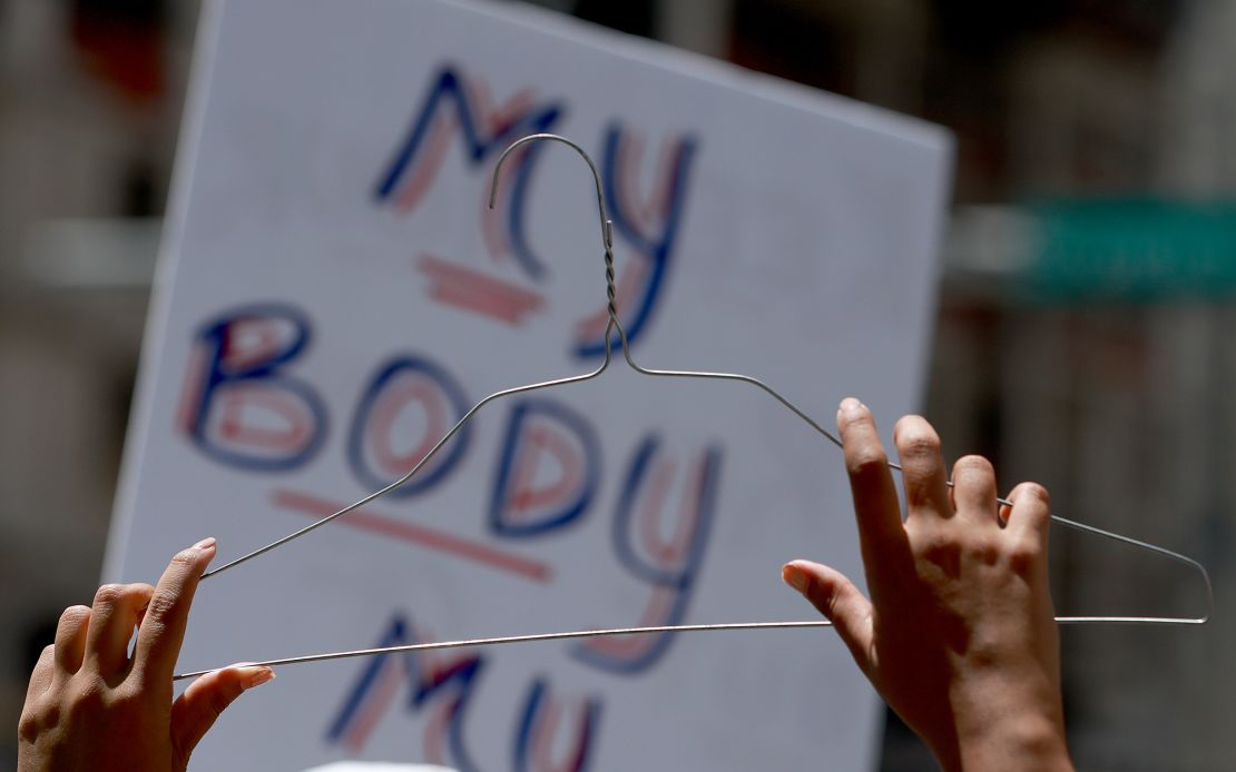 Abortion-rights supporters rally together on May 14 in Fort Lauderdale, Florida, in one of many demonstrations across the US in response to the leaked draft Supreme Court opinion that has suggested the Court is poised to overturn Roe v. Wade.