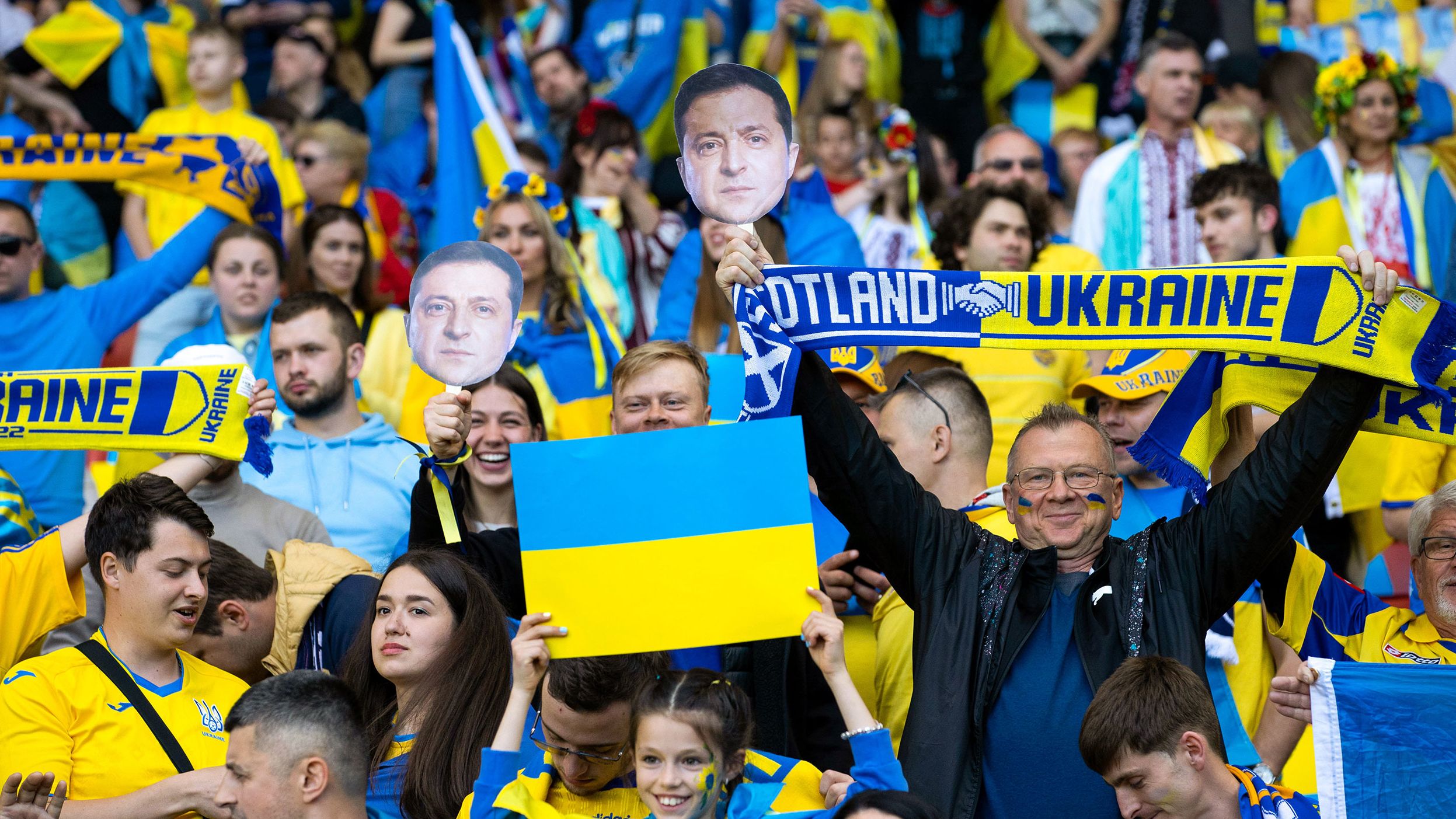 Ukraine Fans with masks of President Volodymyr Zelensky during the World Cup playoff semifinal.