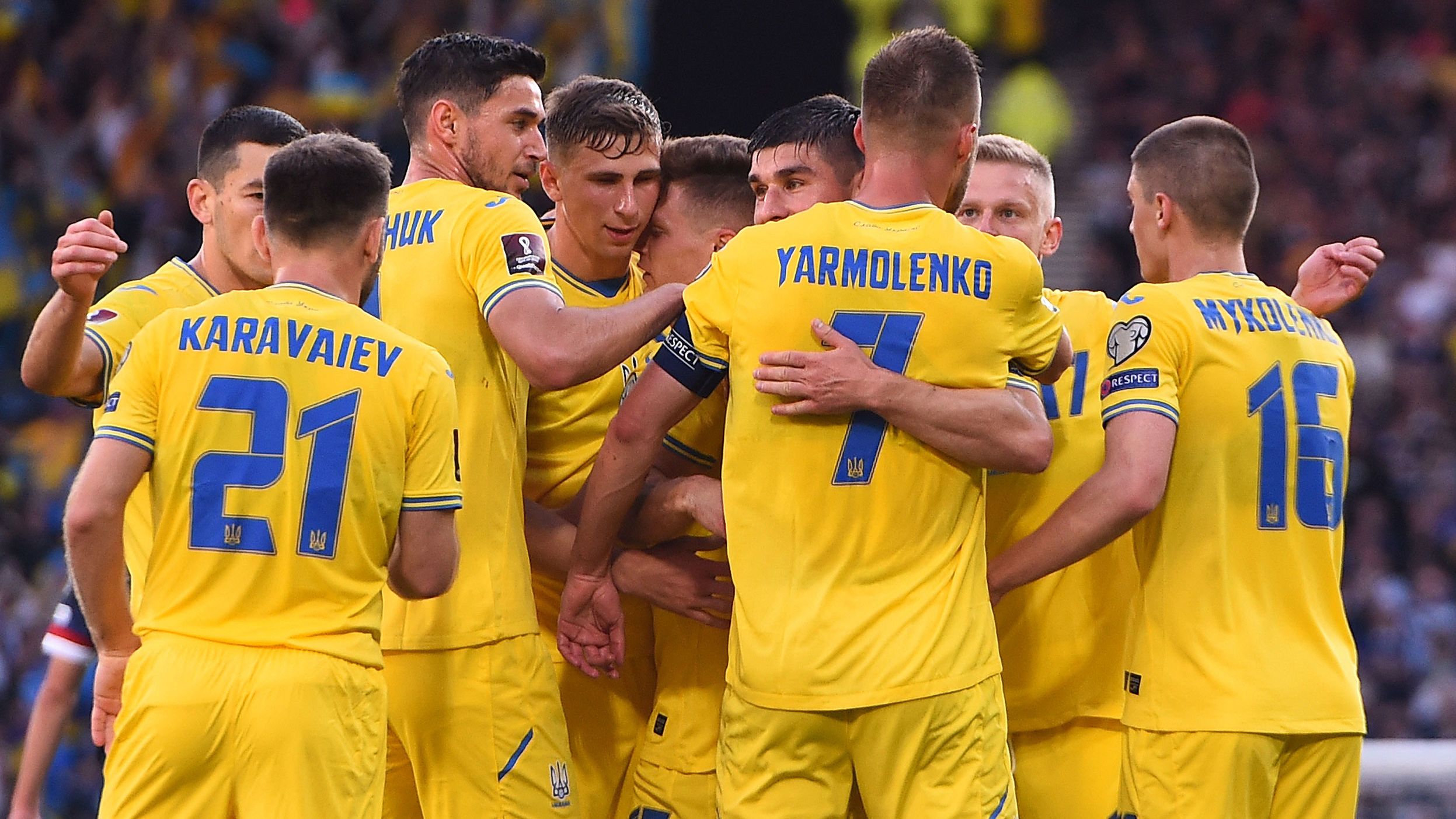 Yarmolenko is mobbed by teammates after scoring the opener. 