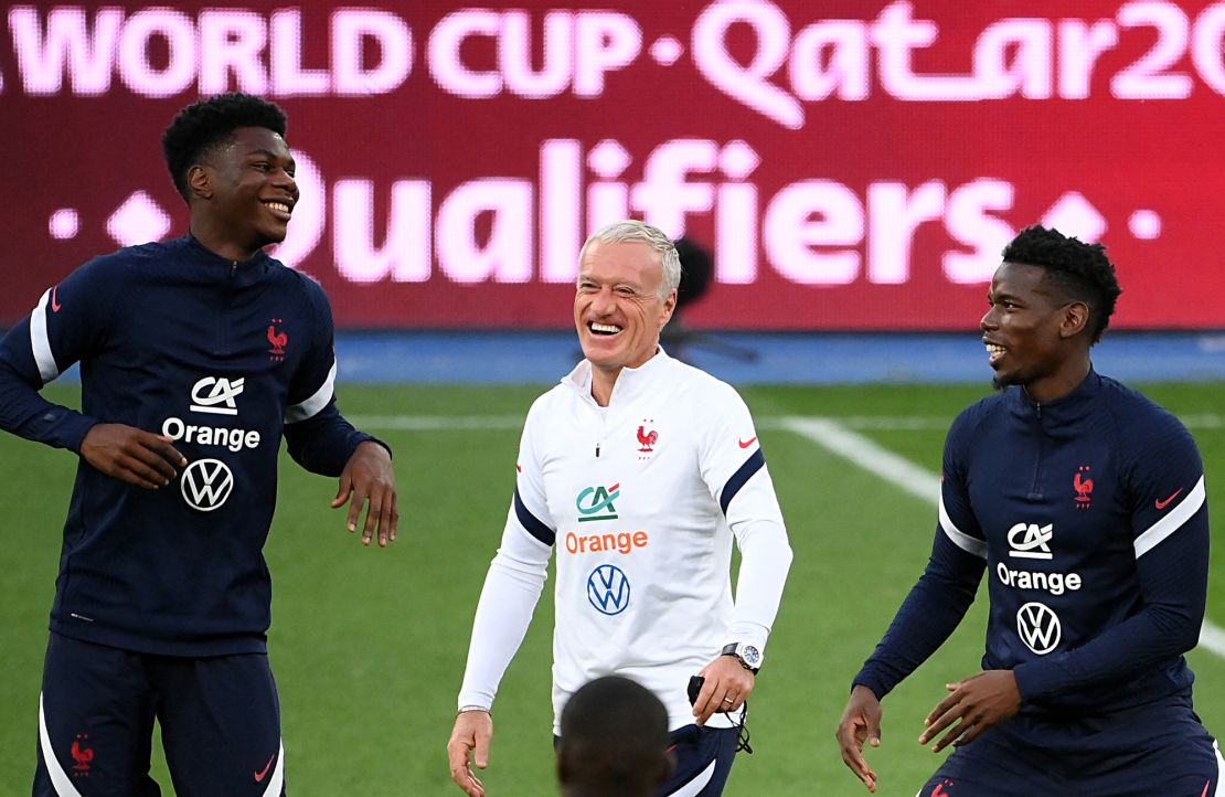 France's head coach Didier Deschamps (center) shares a joke with Pogba (right) and Tchouaméni (left) during a training session in Kyiv in September.