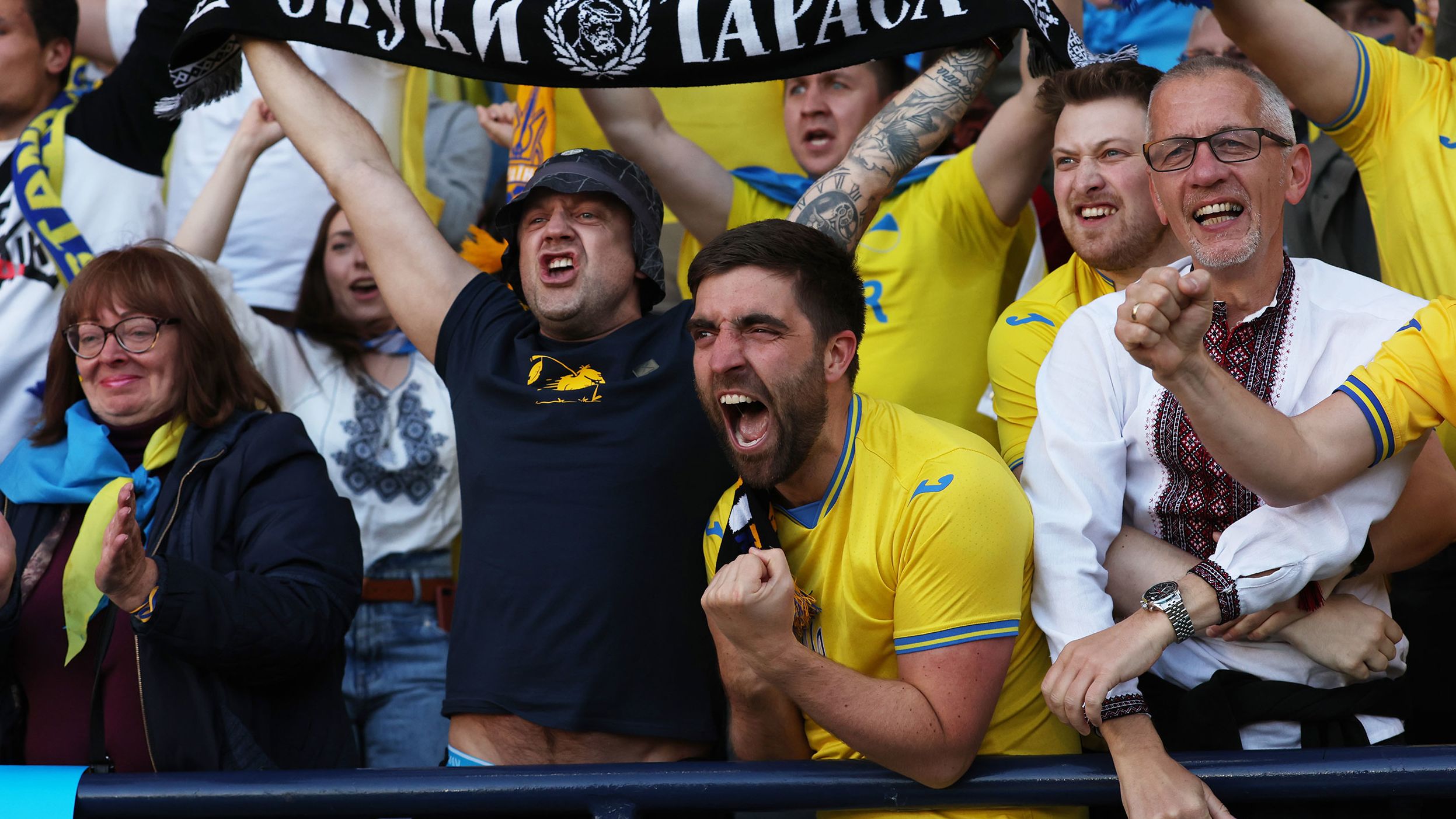 Ukraine fans celebrate after Andriy Yarmolenko scored their side's first goal against Scotland.