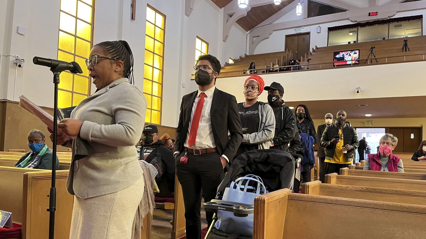 People line up to speak during a reparations task force meeting at Third Baptist Church in San Francisco in April. 