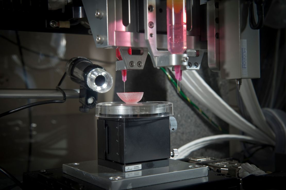 A 3D printer seeds different types of cells onto a kidney scaffold at the Wake Forest Institute for Regenerative Medicine. 