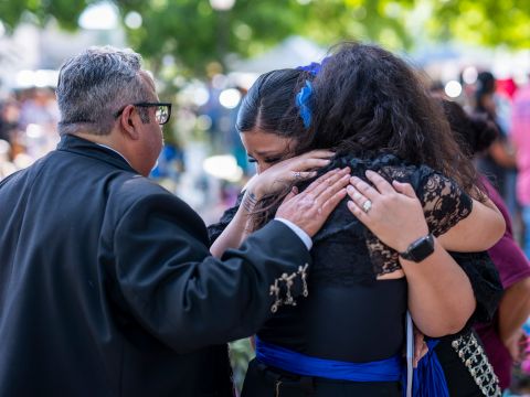 Celia Correa Sauceda, right, hugs her friend Stacey Mazuca after they and other mariachi musicians from San Antonio performed during a memorial in Uvalde on Wednesday, June 1. Sauceda, who plays violin, is an elementary teacher in San Antonio. She said she was in Uvalde to be a voice. 