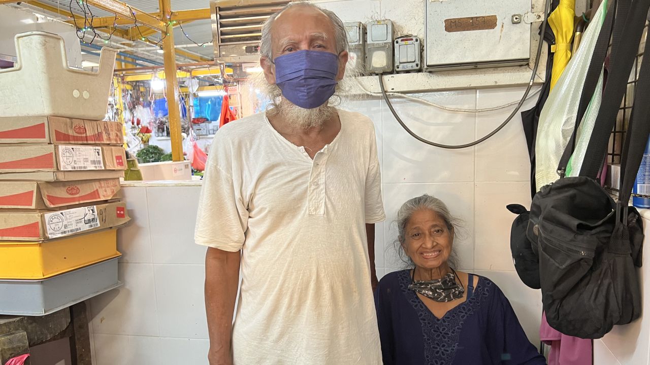 Chicken seller Mohammad Jalehar and his wife at their market stall in Singapore.