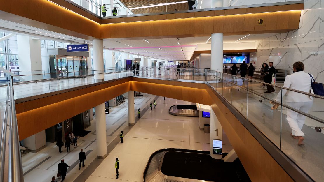 People walk through the newly completed 1.3 million-square foot $4 billion Delta Airlines Terminal C at LaGuardia Airport.