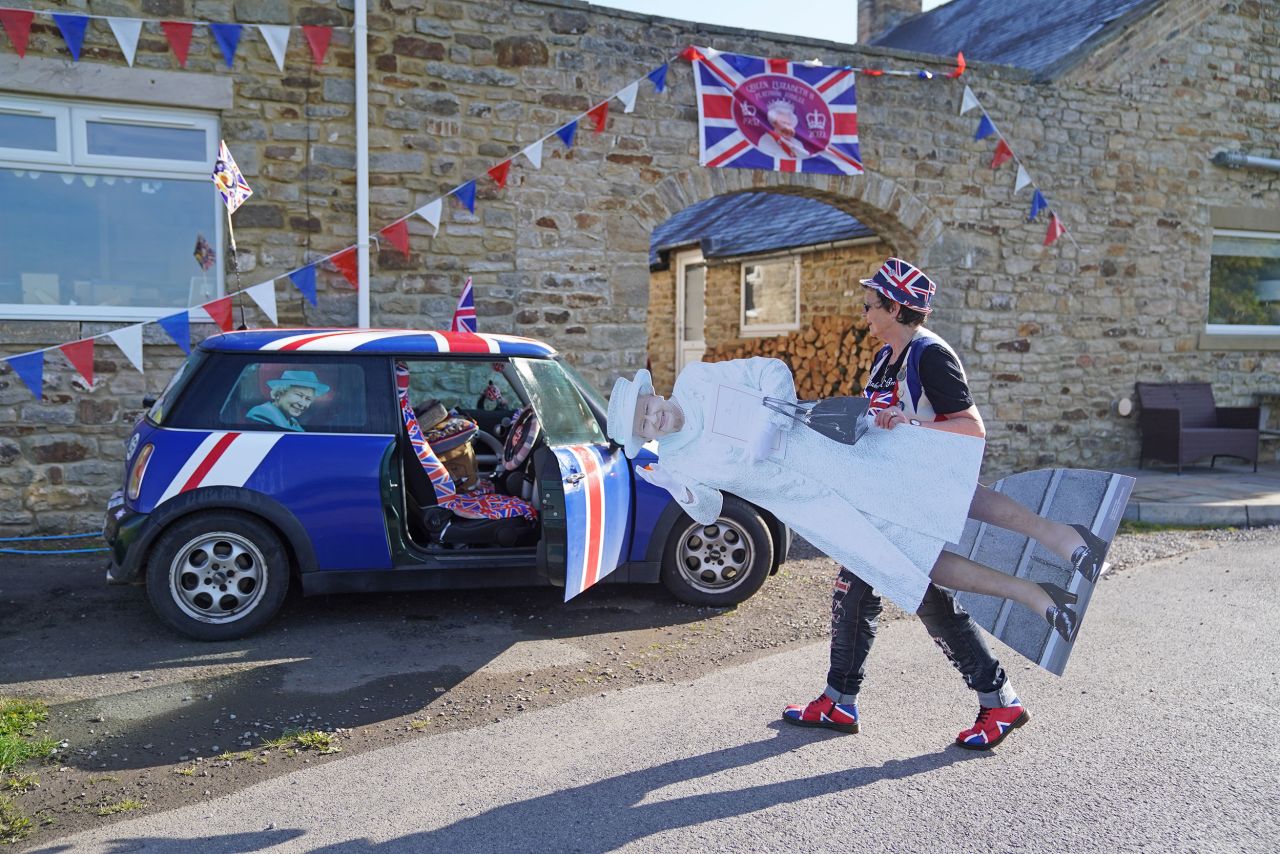 Anita Atkinson, who has collected more than 12,000 items of royal memorabilia, makes her way to a tea party in Durham on Thursday.