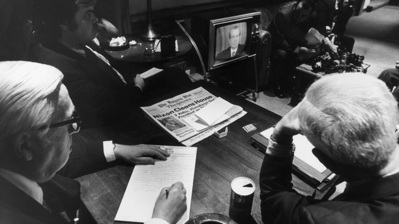 White House reporters watch President Richard Nixon on TV as he told the nation of White House involvement in the Watergate scandal on April 30, 1973.