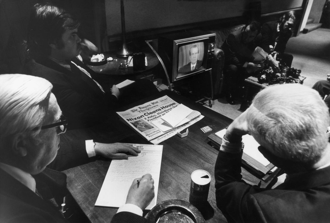 White House reporters watch President Richard Nixon on TV as he told the nation of White House involvement in the Watergate scandal on April 30, 1973.