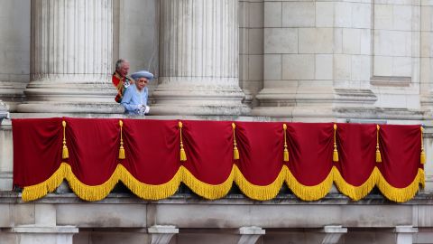 The Queen walks out onto the Buckingham Palace balcony during the Trooping the Colour parade. 
