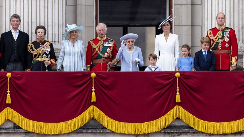 Tim Laurence, from left, Princess Anne, Camilla, Duchess of Cornwall, Prince Charles, Queen Elizabeth II, Prince Louis, Kate, Duchess of Cambridge, Princess Charlotte, Prince George and Prince William on the balcony of Buckingham Palace, London, Thursday June 2, 2022, on the first of four days of celebrations to mark the Platinum Jubilee. The events over a long holiday weekend in the U.K. are meant to celebrate the monarch's 70 years of service. (Humphrey Nemar/Pool Photo via AP)