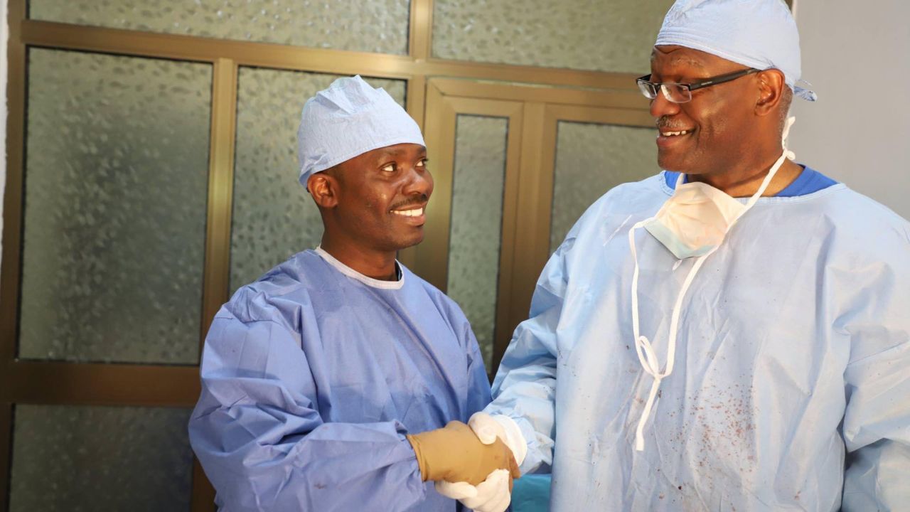 Dr. Preston Phillips, right, shakes hands with Dr. Komi Folly during a medical mission in Togo in 2019.