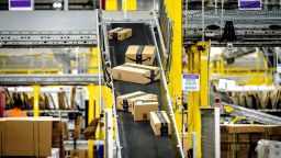 Packages move along a conveyor at Amazon fulfillment center in Eastvale on Tuesday, Aug. 31, 2021.