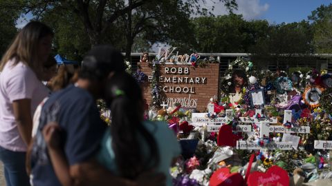 People visit a memorial at Robb Elementary School in Uvalde, Texas, Thursday, June 2, 2022, to pay their respects to the victims killed in last week's school shooting.