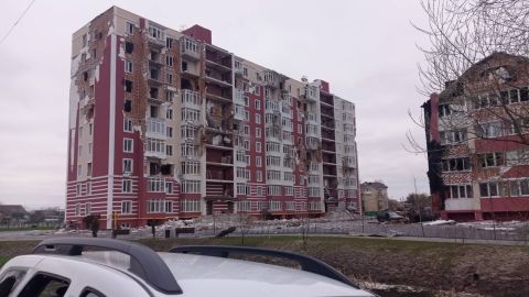 The white car in which the mayor was traveling is seen abandoned near the Pokrovsky residential complex.
