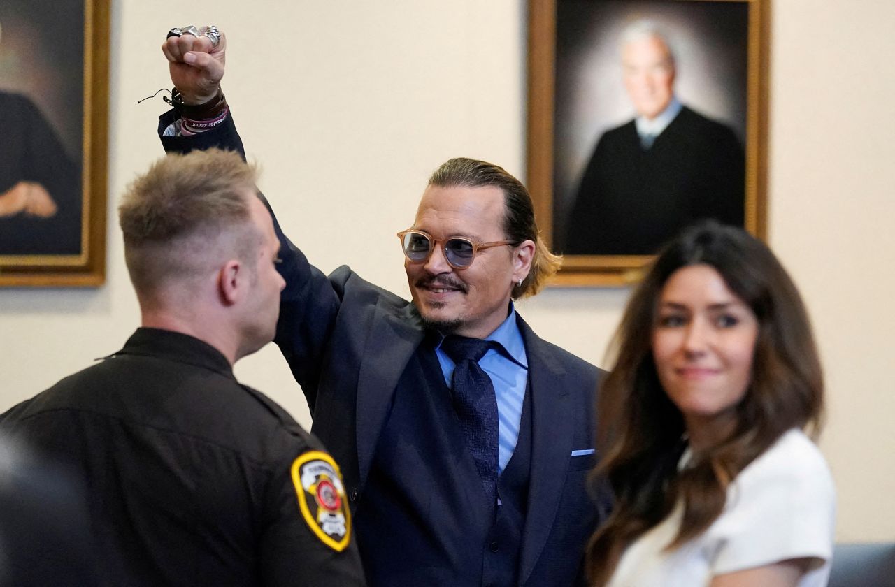 Actor Johnny Depp gestures to spectators at a courthouse in Fairfax, Virginia, after closing arguments finished in his defamation case against ex-wife Amber Heard on Friday, May 27.<a href="https://www.cnn.com/2022/06/01/entertainment/johnny-depp-amber-heard-verdict/index.html" target="_blank"> A jury found both Depp and Heard liable for defamation</a> in their lawsuits against each other, but the jury awarded significantly more damages to Depp.