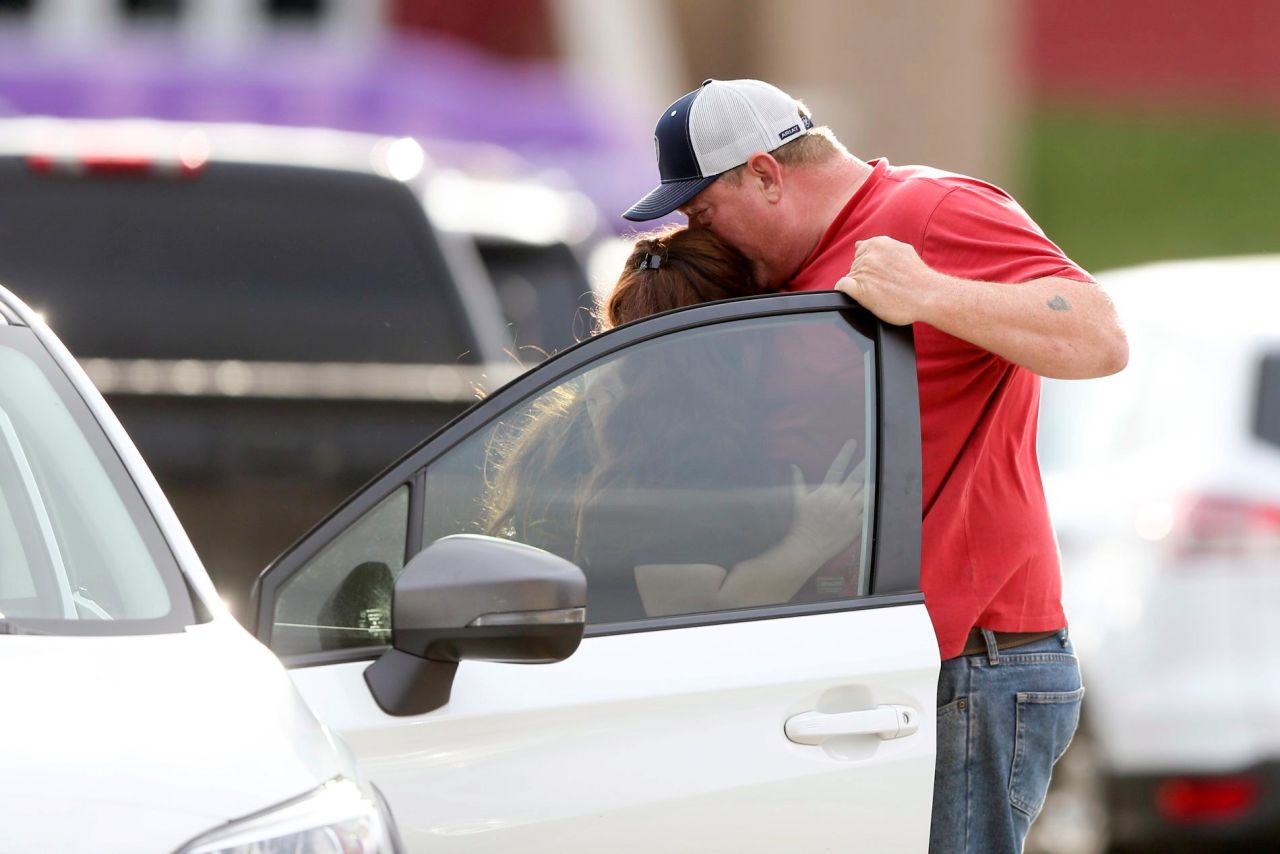 Family members hug as they are reunited after <a href="https://www.cnn.com/2022/06/01/us/tulsa-police-incident-active-shooter/index.html" target="_blank">a shooting at a hospital campus</a> in Tulsa, Oklahoma, on Wednesday, June 1. At least four people were killed in the shooting, police said. The gunman is also dead.