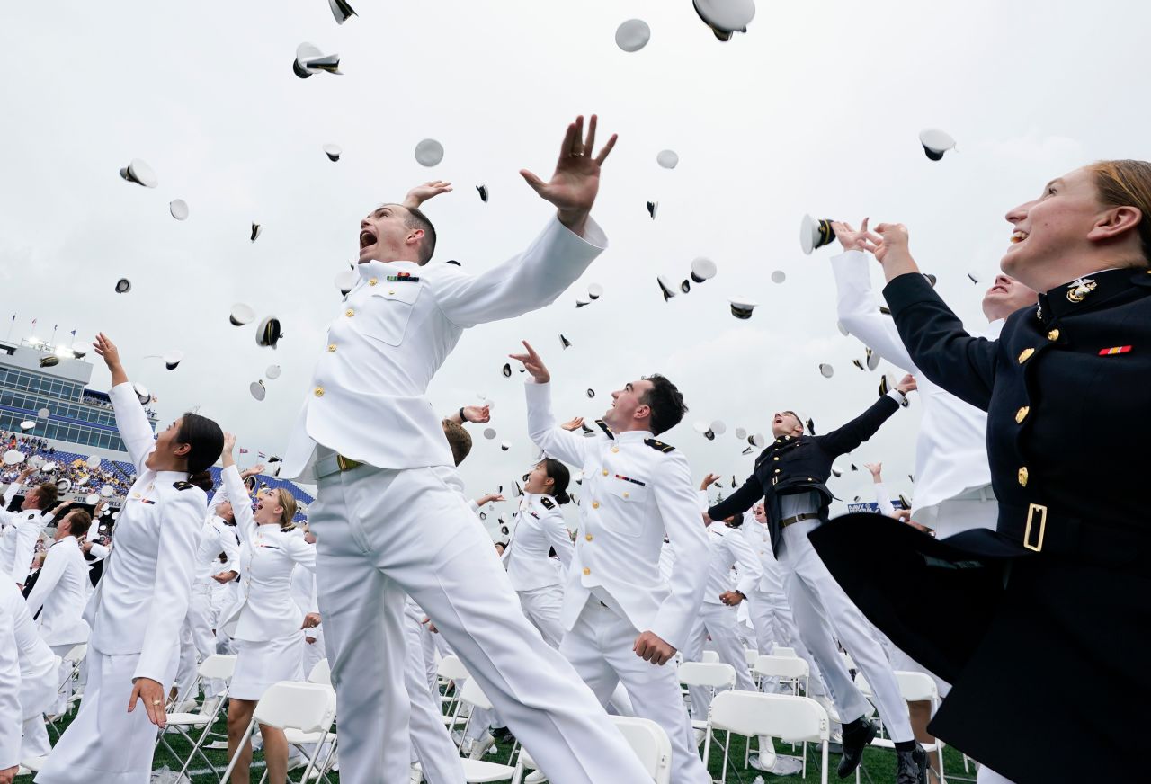 Graduates of the US Naval Academy celebrate at the end of their ceremony in Annapolis, Maryland, on Friday, May 27.