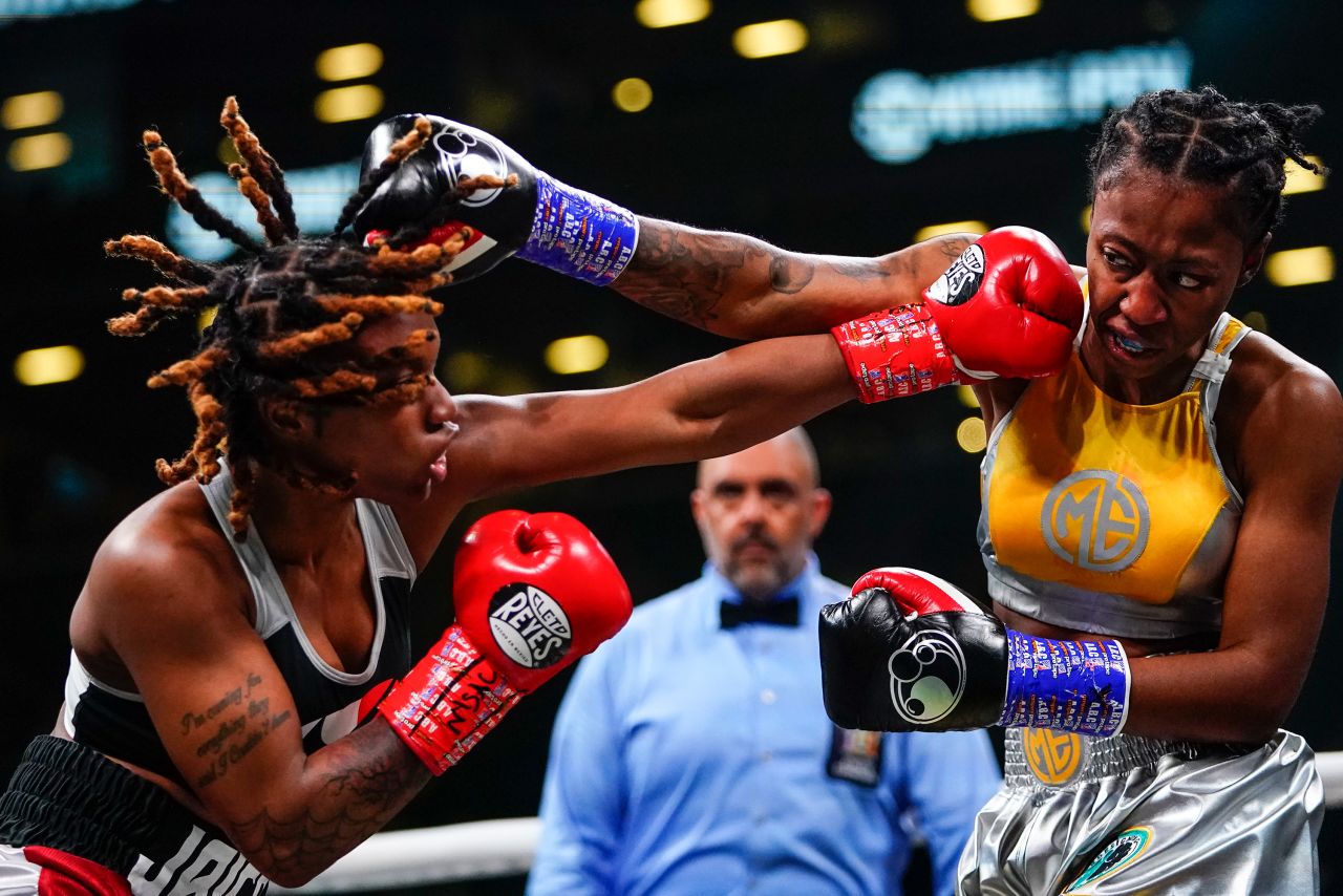 Jaica Pavilus, left, throws a punch at Mia Ellis during the first round of their lightweight bout in New York on Saturday, May 28. Pavilus won by decision.