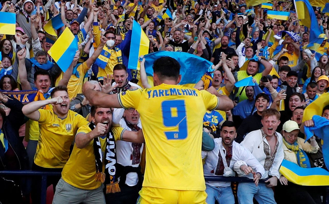 Ukraine's Roman Yaremchuk celebrates with fans after scoring a goal in a World Cup qualifier against Scotland on Wednesday, June 1. <a href="https://www.cnn.com/2022/06/01/football/ukraine-scotland-world-cup-playoff-spt-intl/index.html" target="_blank">Ukraine won 3-1</a> to advance to a playoff final against Wales. The winner of that match will go to the World Cup later this year.