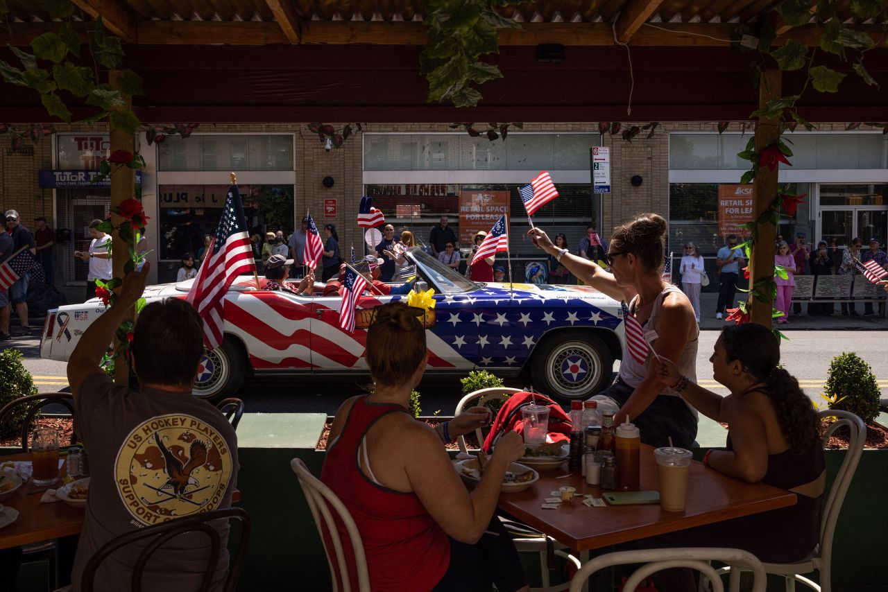 People wave American flags during the Memorial Day Parade in Brooklyn, New York, on Monday, May 30. <a href="http://www.cnn.com/2022/05/29/us/gallery/memorial-day-weekend-2022/index.html" target="_blank">See more photos of Memorial Day weekend in America.</a>