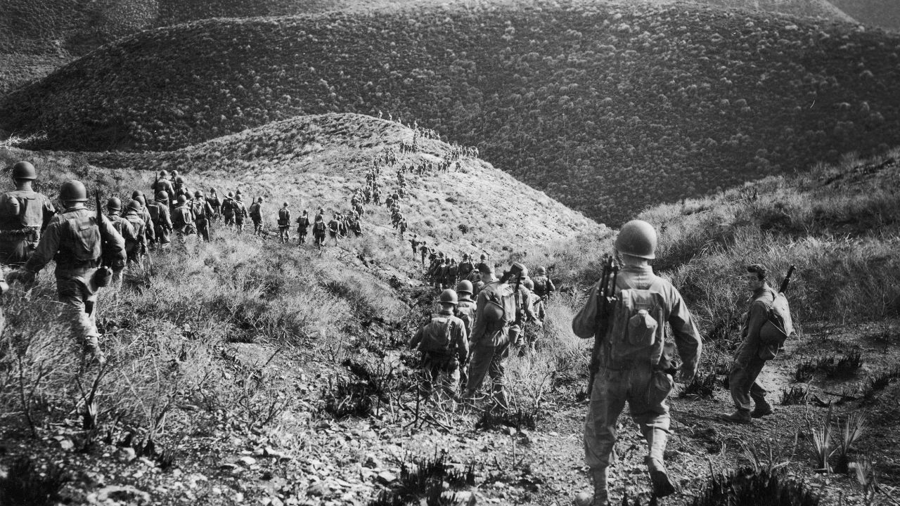 A Ranger Battalion on a speed march over hilly terrain during a manoeuvre operation on January 20, 1943, in North Africa.