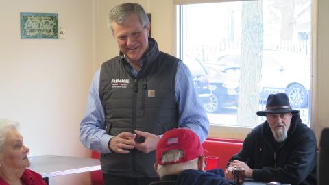 Kevin Rinke, a Republican candidate for governor, meets with people on Monday, May 2, 2022, at Fleetwood Diner in Lansing, Mich. Rinke launched a 10-day bus tour across Michigan three months before the August GOP primary. (AP Photo/David Eggert)