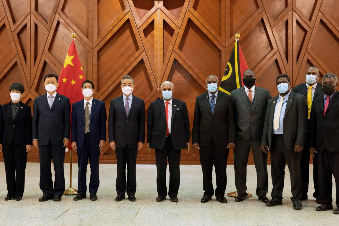 Vanuatu's Prime Minister Bob Loughman Weibur and visiting Chinese Foreign Minister Wang Yi pose with officials following a signing ceremony for agreements between the two countries in the capital city Port Vila on June 1, 2022. 