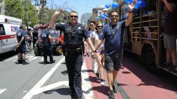 SAN FRANCISCO, CALIFORNIA - JUNE 30: San Francisco policemen hold hands while walking during the San Francisco Pride Parade and Celebration 2019 on June 30, 2019 in San Francisco, California. (Photo by Arun Nevader/Getty Images)