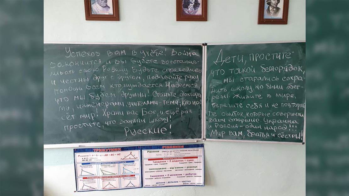 A note that was found on a blackboard in a school in Katyuzhanka after Russian troops left the area. One phrase says: "Ukraine and Russia are one people!!!"