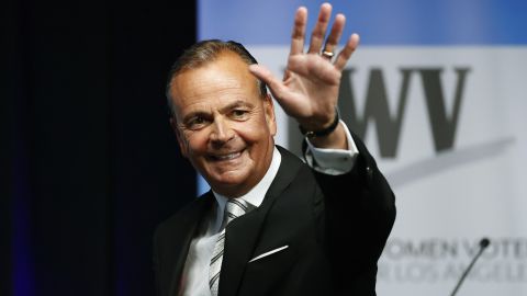 Los Angeles mayoral hopeful Rick Caruso waves at the start of a  debate on the California State University, Los Angeles, campus on May 1, 2022. 