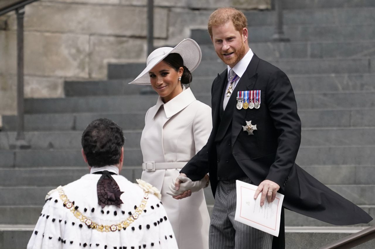 Prince Harry and his wife Meghan, the Duchess of Sussex, depart St Paul's Cathedral in London after attending a service honoring the Queen on Friday. Harry and Meghan, who flew from the United States for the jubilee celebrations, were warmly welcomed by a crowd outside the service. Ahead of the event, there was much speculation in the British press over how the couple would be received following their decision to step back from the royal family and move to California two years ago.