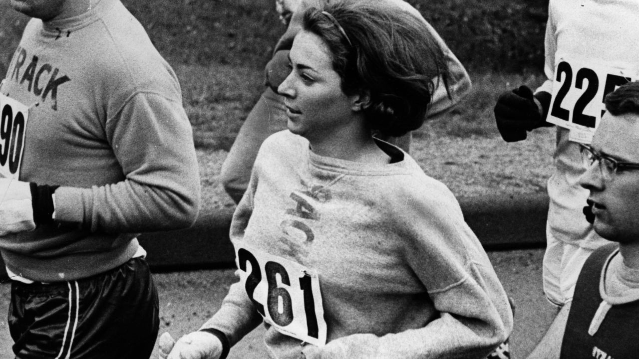 ASHLAND, MA - APRIL 19: Kathy Switzer of Syracuse (261)  and Rocky Chamberlain directly behind during the Boston Marathon. (Photo by Paul J. Connell/The Boston Globe via Getty Images)