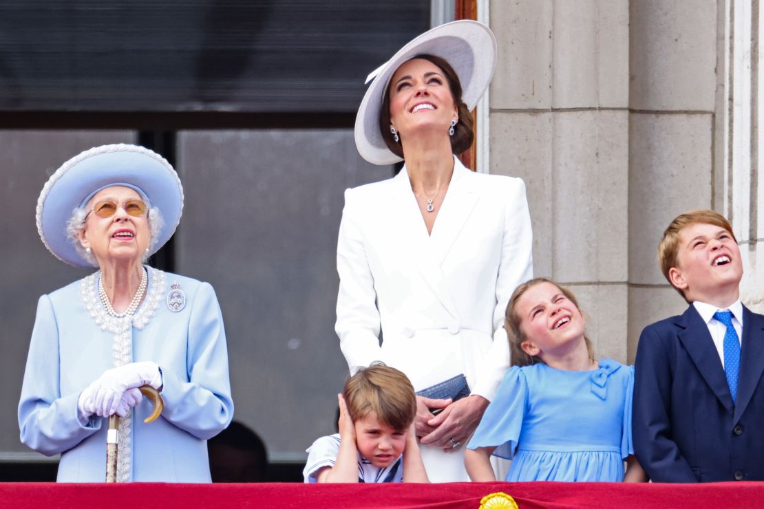 Queen Elizabeth II, Prince Louis, Catherine, Duchess of Cambridge, Princess Charlotte and Prince George watch the Royal Air Force flypast from the balcony of Buckingham Palace on Thursday.